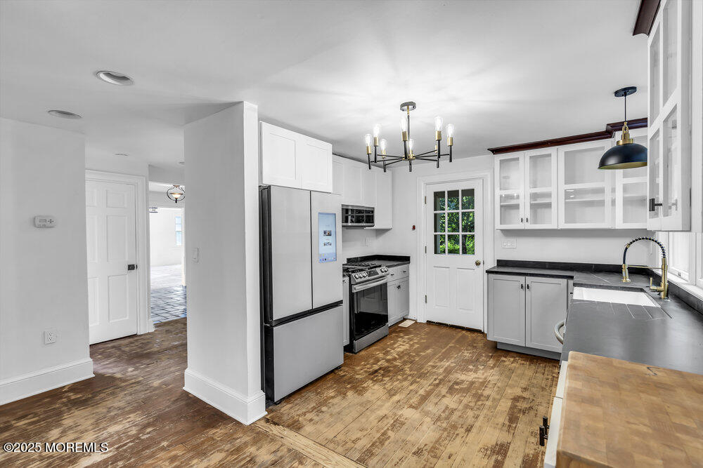 4 Oneida Avenue Atlantic Highlands, NJ 07716 - Photo 19 of 80 a kitchen with granite countertop a refrigerator and a sink