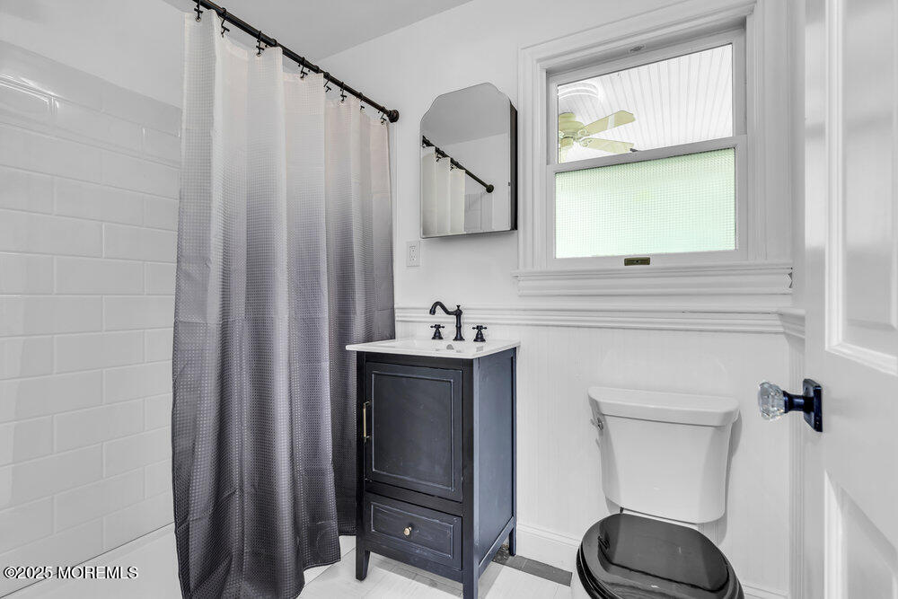 4 Oneida Avenue Atlantic Highlands, NJ 07716 - Photo 20 of 80 a bathroom with a sink a toilet and a mirror
