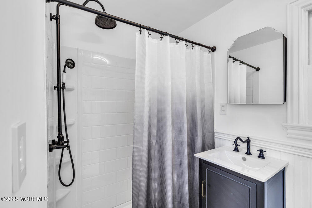 4 Oneida Avenue Atlantic Highlands, NJ 07716 - Photo 21 of 80 a bathroom with a sink a vanity and a mirror
