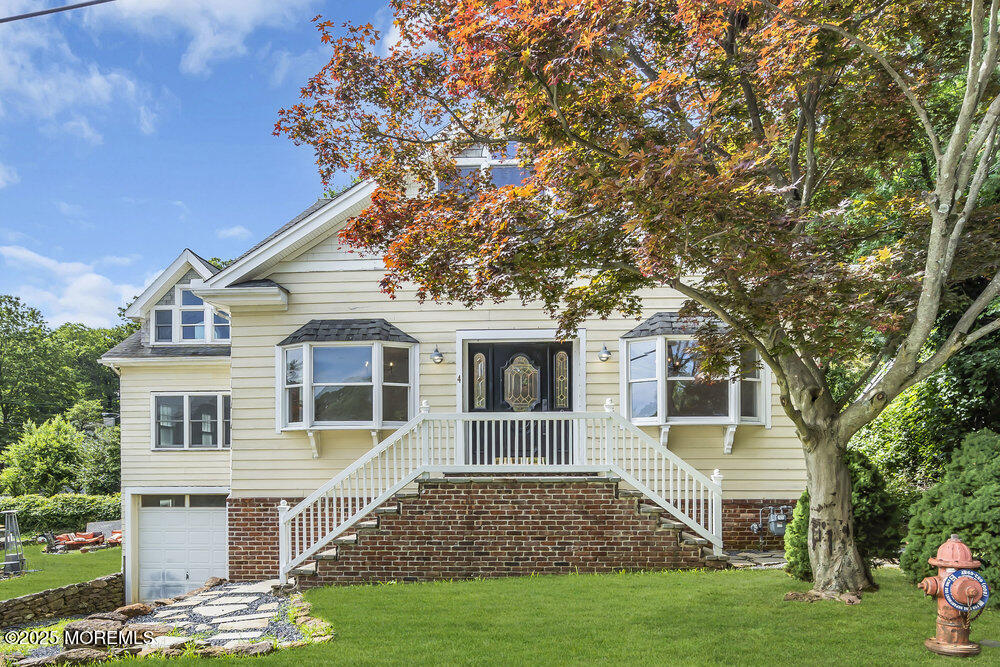 4 Oneida Avenue Atlantic Highlands, NJ 07716 - Photo 3 of 80 a front view of a house with a garden