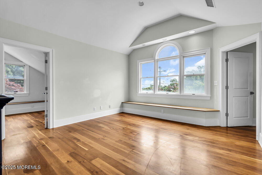 4 Oneida Avenue Atlantic Highlands, NJ 07716 - Photo 37 of 80 a view of an empty room with wooden floor and a window