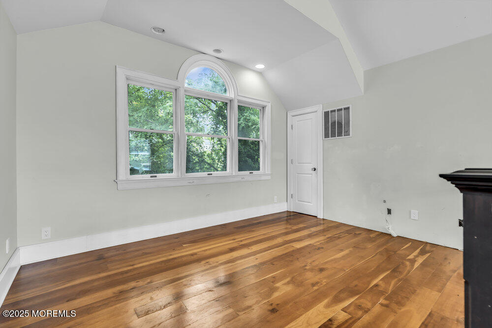 4 Oneida Avenue Atlantic Highlands, NJ 07716 - Photo 39 of 80 a view of empty room with wooden floor and fan