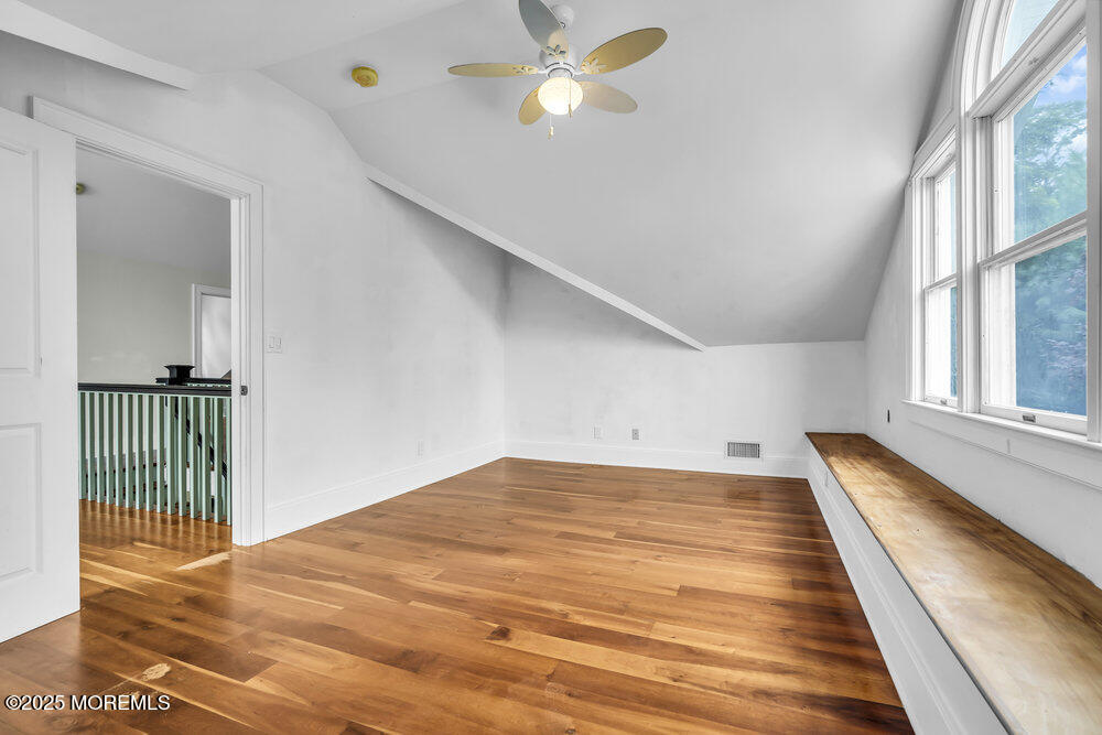 4 Oneida Avenue Atlantic Highlands, NJ 07716 - Photo 43 of 80 a view of a bedroom with wooden floor and a window