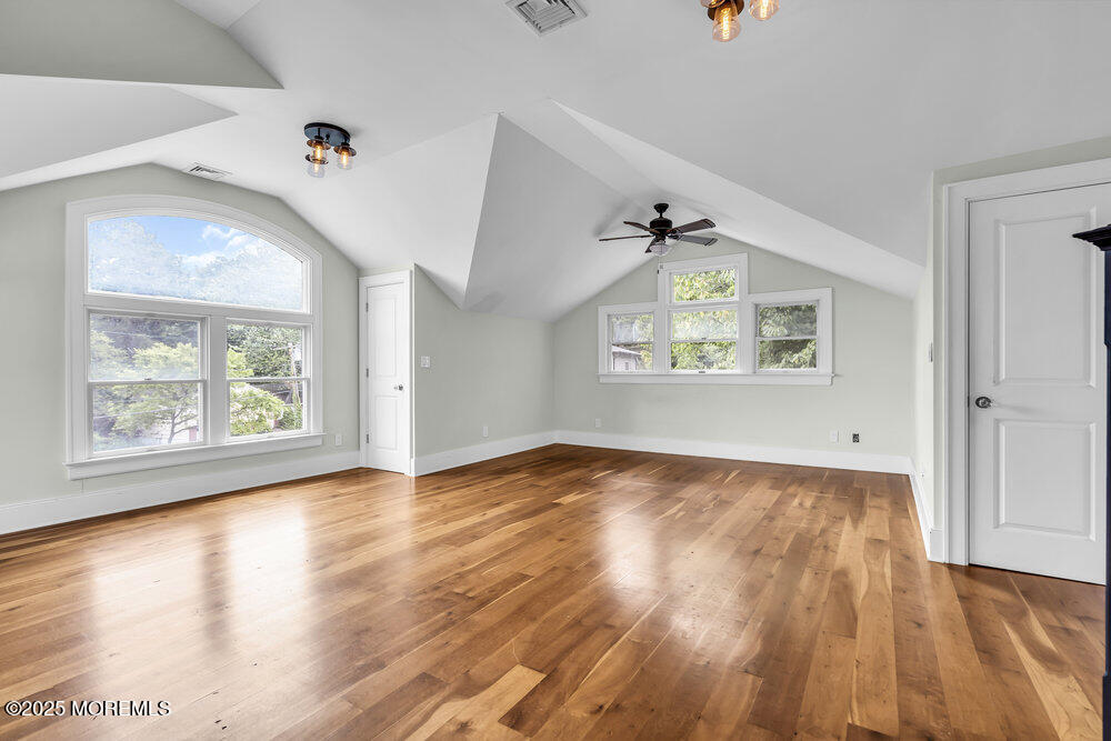 4 Oneida Avenue Atlantic Highlands, NJ 07716 - Photo 48 of 80 a view of an empty room with wooden floor and a window