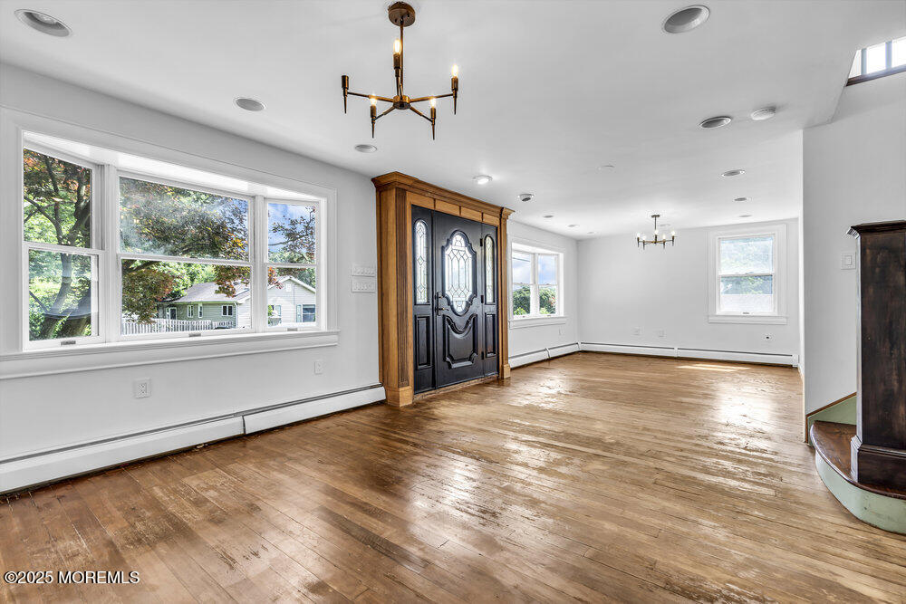 4 Oneida Avenue Atlantic Highlands, NJ 07716 - Photo 5 of 80 a view of empty room with wooden floor and fan