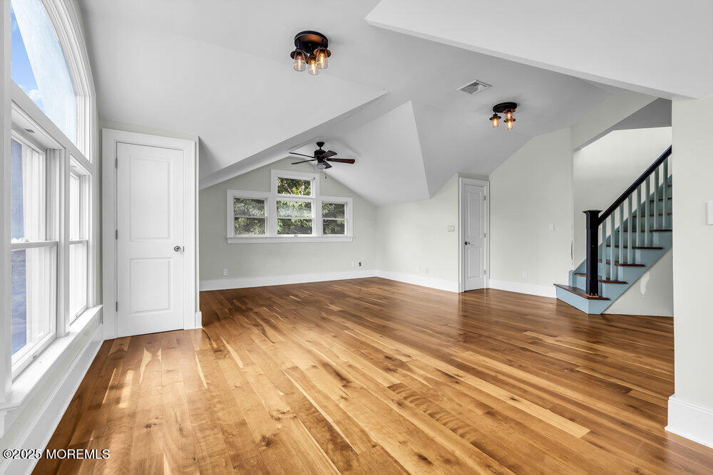 4 Oneida Avenue Atlantic Highlands, NJ 07716 - Photo 50 of 80 a view of empty room with wooden floor and fan