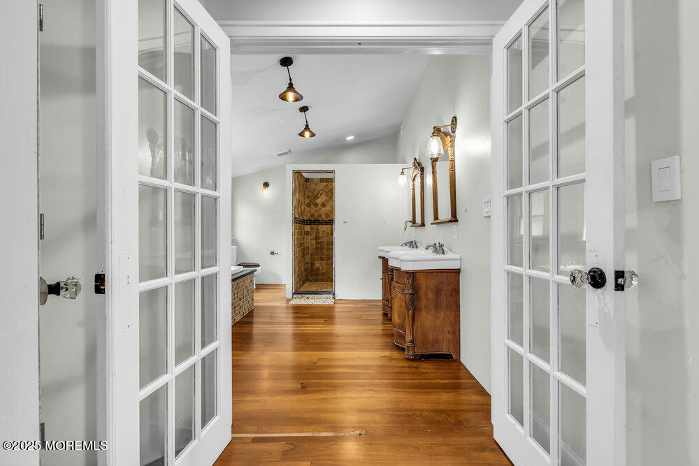 4 Oneida Avenue Atlantic Highlands, NJ 07716 - Photo 55 of 80 a view of a hallway with wooden floor and staircase