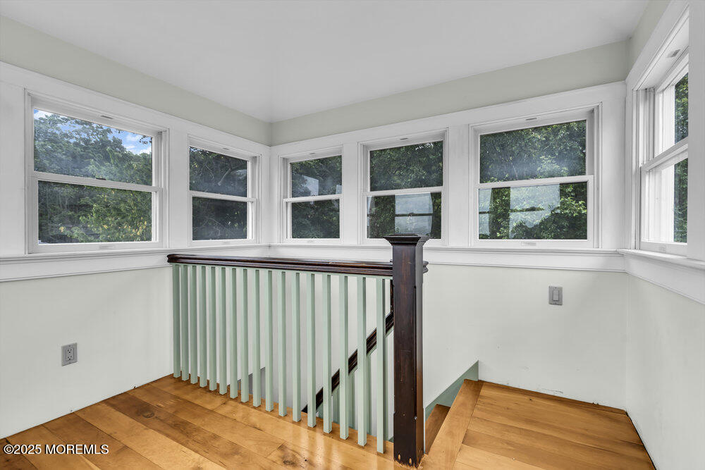 4 Oneida Avenue Atlantic Highlands, NJ 07716 - Photo 64 of 80 a view of a bedroom with wooden floor and a window