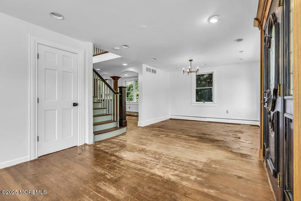 4 Oneida Avenue Atlantic Highlands, NJ 07716 - Photo 8 of 80 a view of an empty room with window and wooden floor