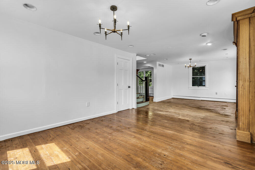 4 Oneida Avenue Atlantic Highlands, NJ 07716 - Photo 9 of 80 a view of empty room with wooden floor and windows