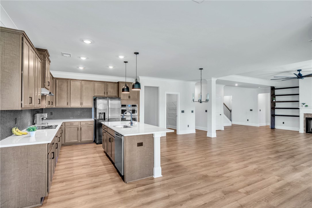 226 Holly Br Road Piedmont, SC 29673 - Photo 9 of 44 A streamlined open-concept design integrates the chef's kitchen with a spacious living area.