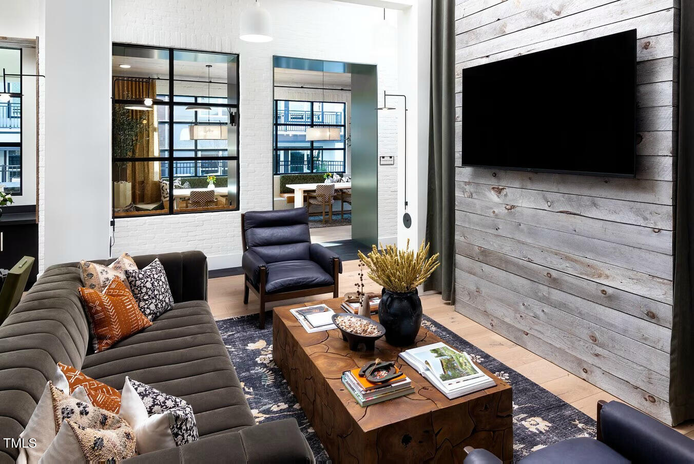 821 Hanbury Way, Unit A1 Raleigh, NC 27607 - Photo 18 of 43 a living room with furniture and a flat screen tv