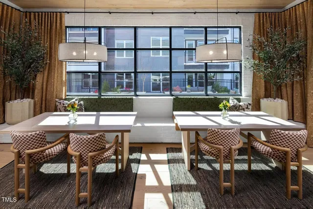a view of a dining table and chairs in the patio