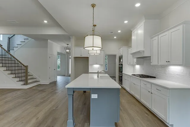 a view of a livingroom and a hallway