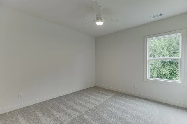 a bathroom with a double vanity sink a mirror and a bathtub