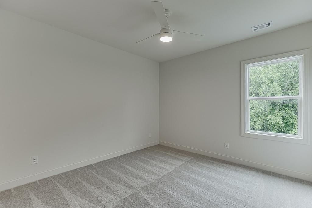 314 Level Creek Road Sugar Hill, GA 30518 - Photo 34 of 62 an empty room with a window