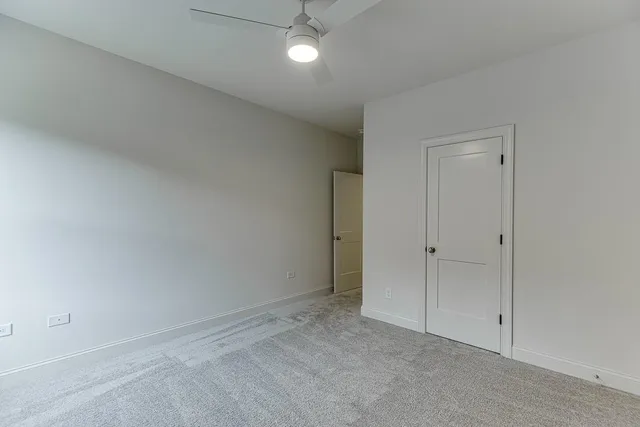a bathroom with double vanity sinks and a mirror