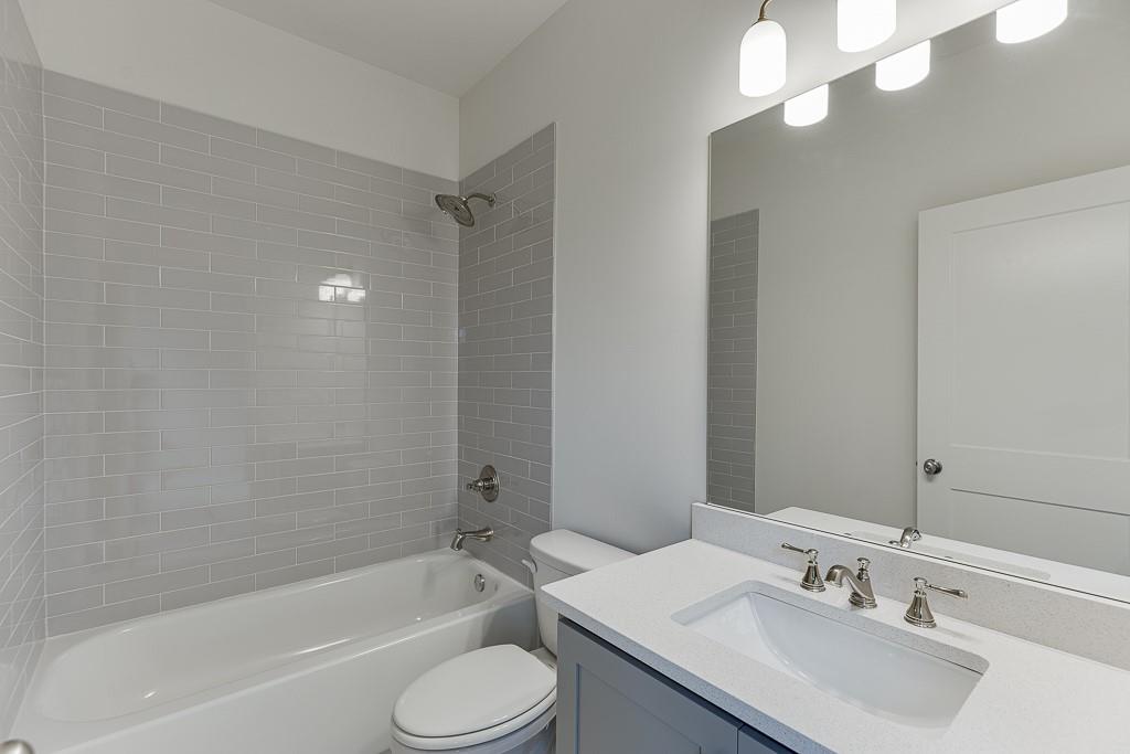 314 Level Creek Road Sugar Hill, GA 30518 - Photo 39 of 62 a bathroom with a sink a toilet and shower