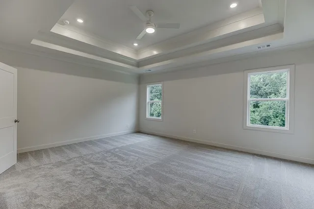 a view of an empty room with windows