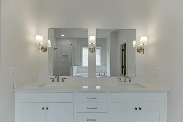 an aerial view of a house a yard and lake view