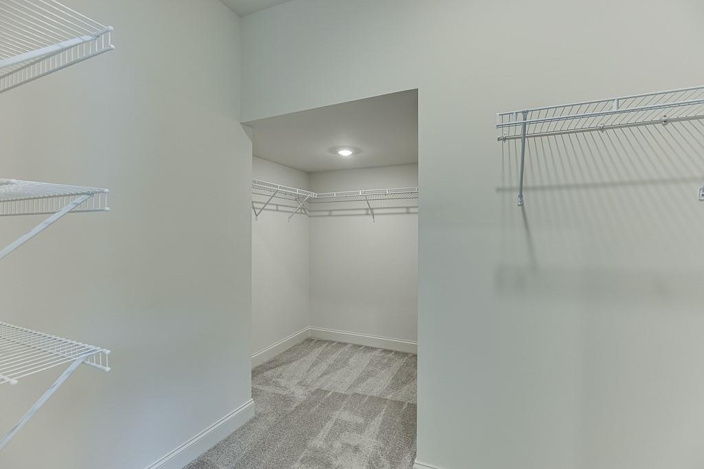 314 Level Creek Road Sugar Hill, GA 30518 - Photo 47 of 62 a view of a room with racks on the wall