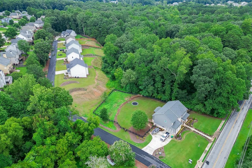 314 Level Creek Road Sugar Hill, GA 30518 - Photo 53 of 62 an aerial view of a house with a yard and trees