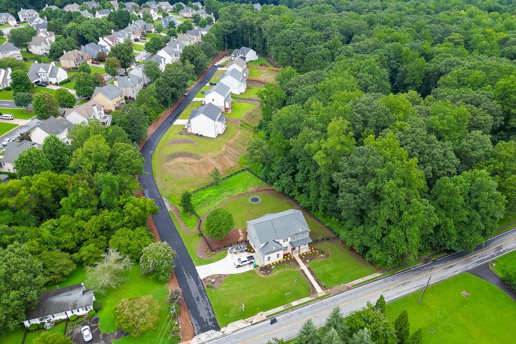 314 Level Creek Road Sugar Hill, GA 30518 - Photo 54 of 62 an aerial view of a house with a garden and trees
