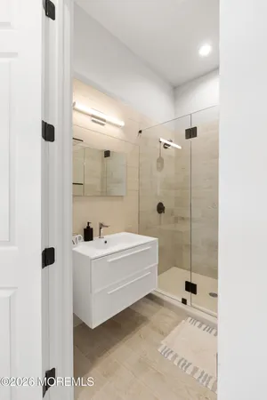 a bathroom with a toilet a sink and bathtub