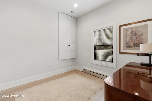 a room with a bed and a window