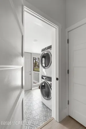 a view of a hallway with washer and dryer