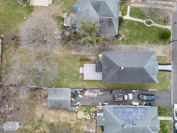 a view of a backyard with large trees