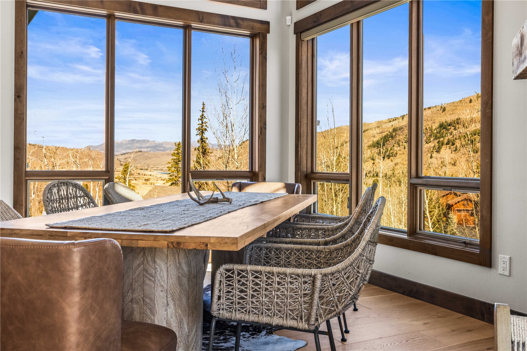 230 Game Trail Road Silverthorne, CO 80498 - Photo 8 of 43 a dining room with furniture and large windows