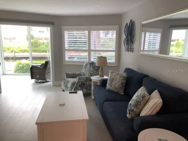 a bedroom with a large bed and a large window