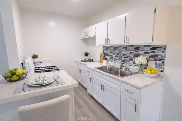 a spacious bedroom with a bed and a walk in closet