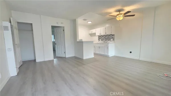 a kitchen with a sink and a refrigerator