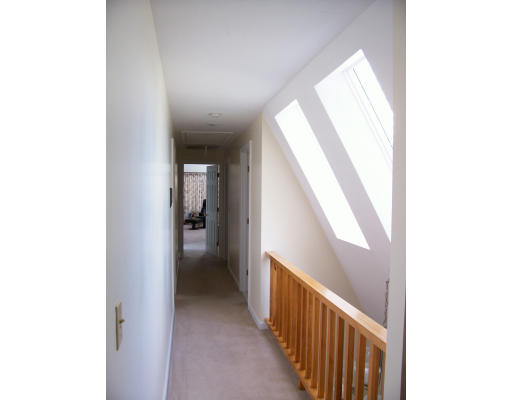 46 Azalea Road Sharon, MA 02067 - Photo 15 of 28 a view of a hallway with wooden floor and a bathroom