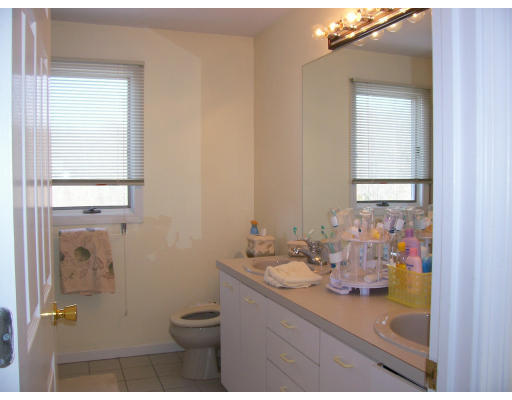 46 Azalea Road Sharon, MA 02067 - Photo 16 of 28 a bathroom with a sink a toilet and a mirror