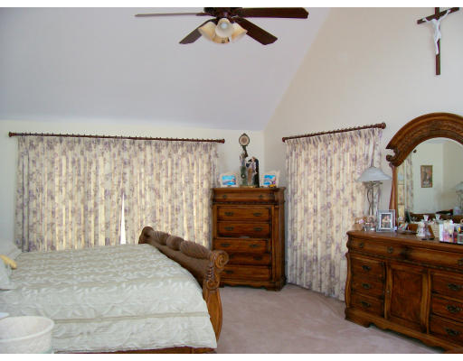46 Azalea Road Sharon, MA 02067 - Photo 17 of 28 a bedroom with a bed and a dresser