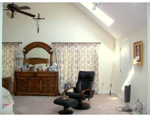 46 Azalea Road Sharon, MA 02067 - Photo 18 of 28 a living room with furniture and a mirror
