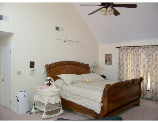 46 Azalea Road Sharon, MA 02067 - Photo 20 of 28 a bedroom with a bed and a couch