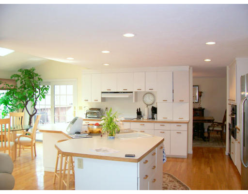 46 Azalea Road Sharon, MA 02067 - Photo 2 of 28 a kitchen with kitchen island a sink table and chairs