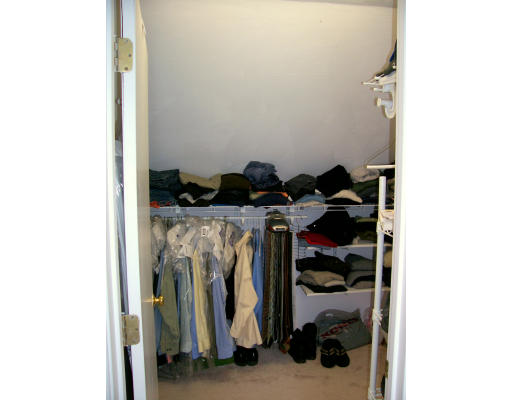 46 Azalea Road Sharon, MA 02067 - Photo 22 of 28 a view of walk in closet with clothes and shoes