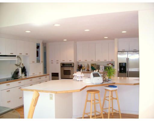 46 Azalea Road Sharon, MA 02067 - Photo 3 of 28 a kitchen with stainless steel appliances kitchen island granite countertop a sink and cabinets