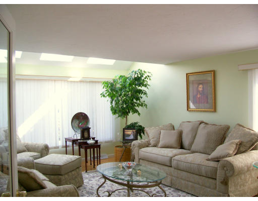46 Azalea Road Sharon, MA 02067 - Photo 7 of 28 a living room with furniture a rug and a large window