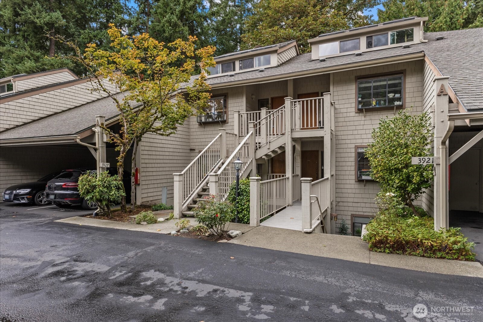 3921 108th Avenue Northeast, Unit A101 Bellevue, WA 98004 - Photo 1 of 27 a view of a house with a yard and potted plants