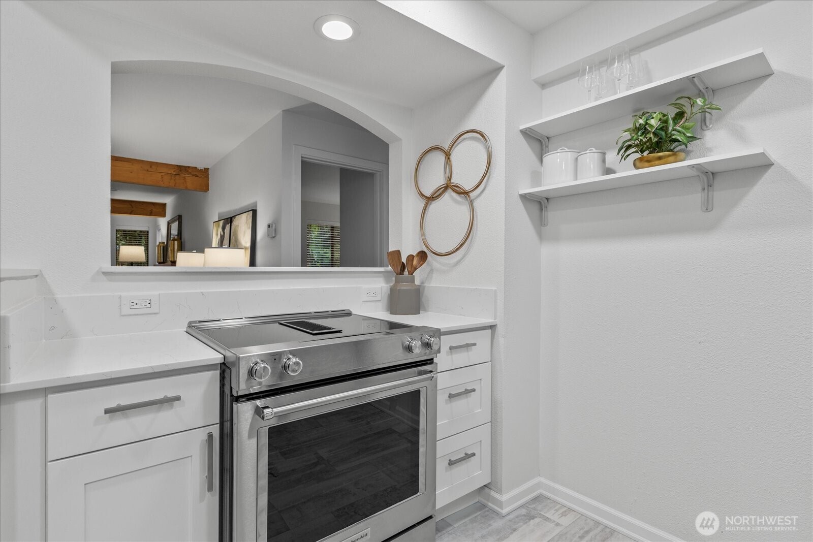 3921 108th Avenue Northeast, Unit A101 Bellevue, WA 98004 - Photo 12 of 27 a kitchen with a stove and cabinets
