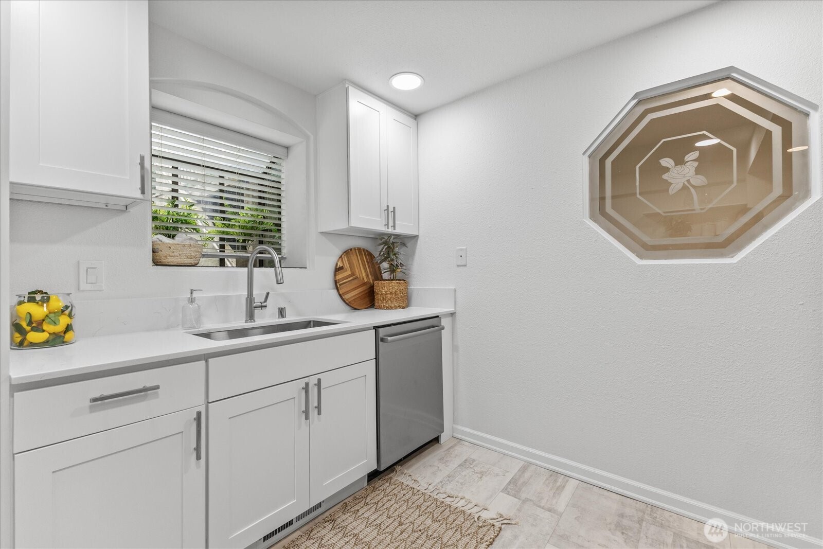 3921 108th Avenue Northeast, Unit A101 Bellevue, WA 98004 - Photo 13 of 27 a bathroom with a sink and a vanity