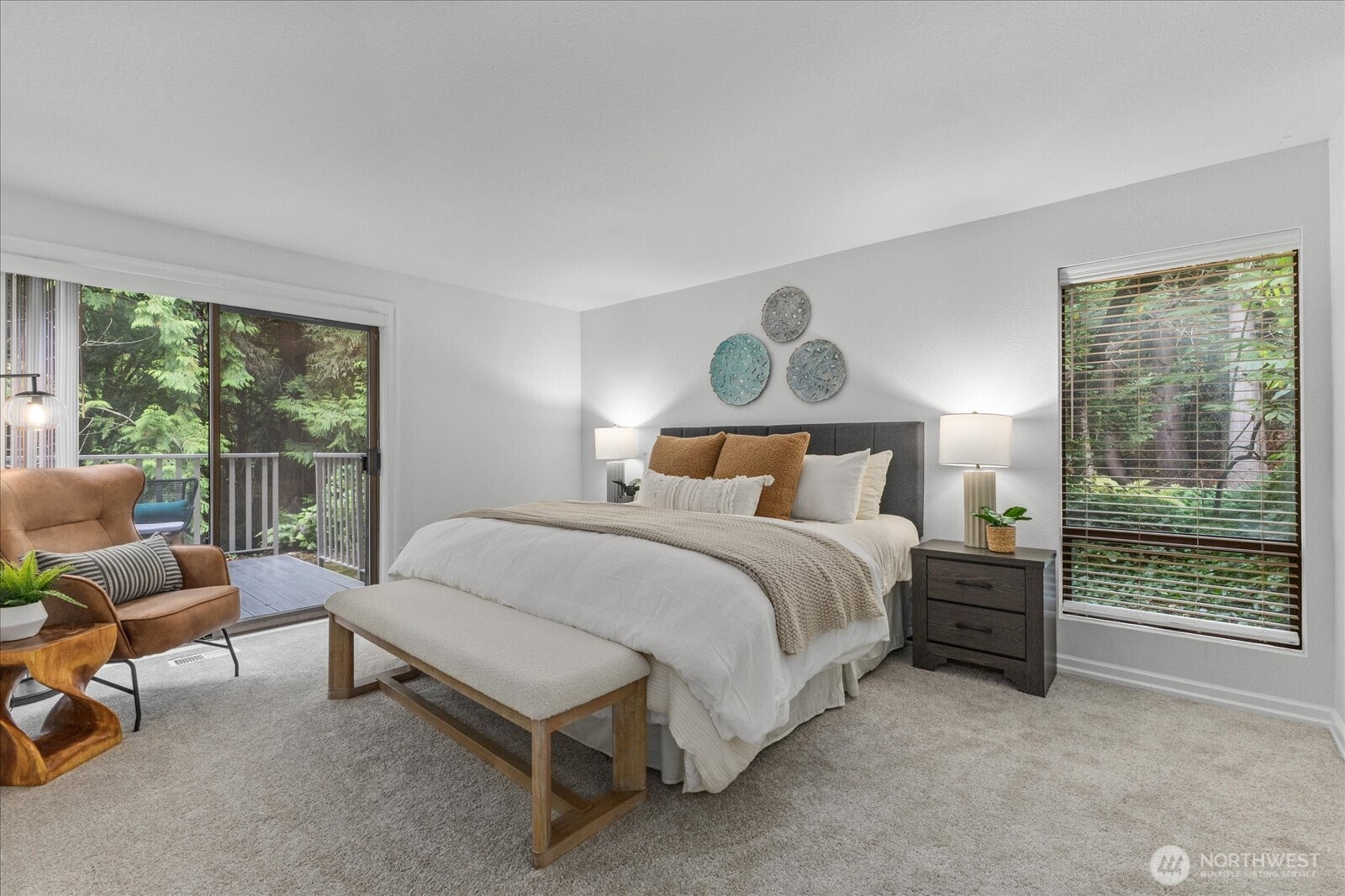 3921 108th Avenue Northeast, Unit A101 Bellevue, WA 98004 - Photo 14 of 27 a bedroom with a bed and a large window