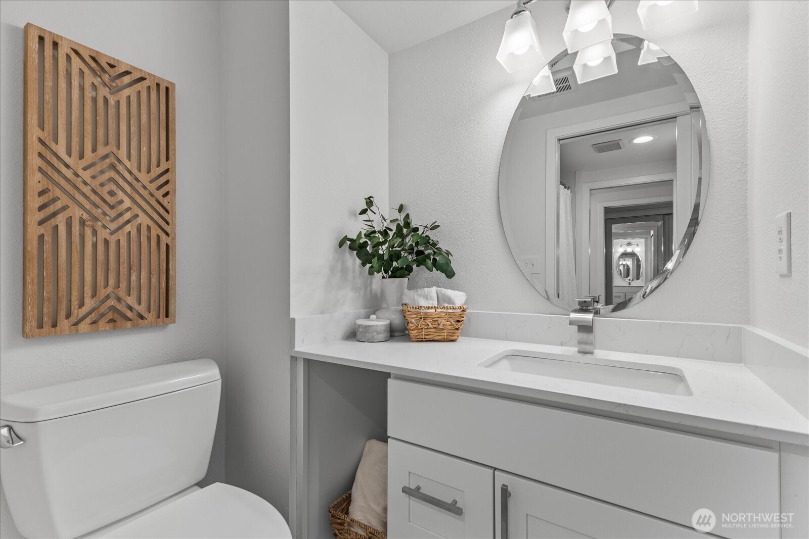 3921 108th Avenue Northeast, Unit A101 Bellevue, WA 98004 - Photo 16 of 27 a bathroom with a toilet sink and mirror