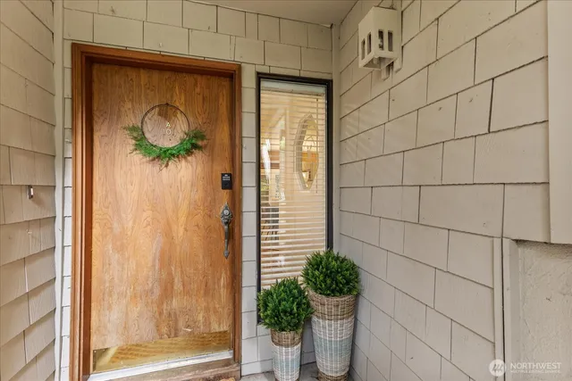 a glass door with a glass door and shower